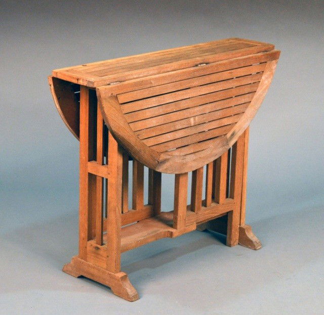 Drop Leaf Oak Center Table: Height 30 inches, diameter (open) 37 inches.