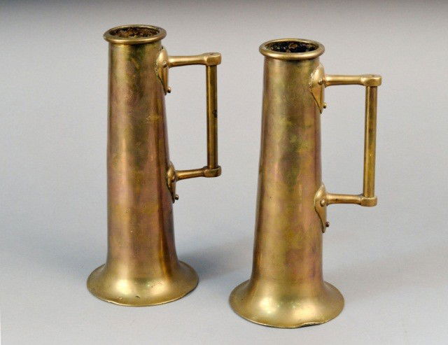 Pair of Brass Tankards: Tapered cylindrical body with a single handle on a flared foot. Height 11 1/2 inches.