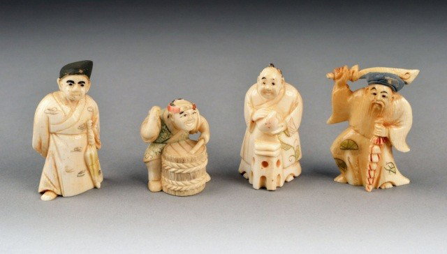 Four Carved Ivory Netsukes: Each a carved figure, all signed. Tallest 2 inches.