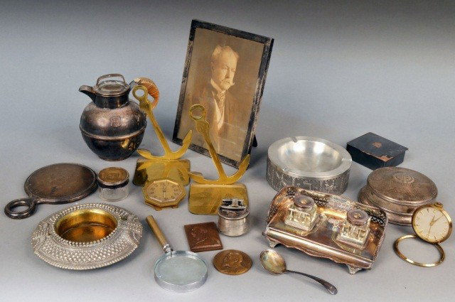 Miscellaneous Group of Metal Decorations: Including a sterling silver picture frame, a silver hand mirror, silver plated box and ink stand, two bronze medals, etc.
