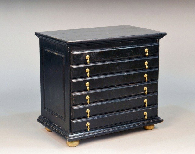 William and Mary Style Jewelry Chest: Ebonized with brass tear drop handles and gilt painted suppressed ball feet. Height 25 inches, width 27 inches, depth 17 inches.