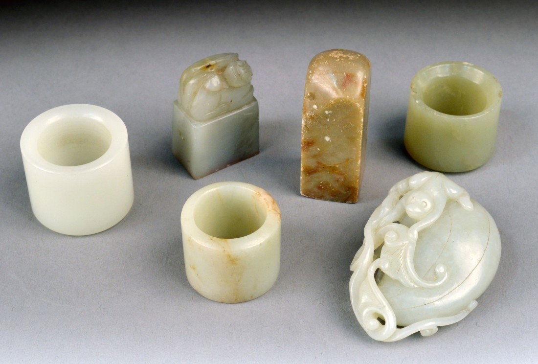 Group of Chinese Carved Jade & Soapstone: Carved jade pendant, two soapstone seals and three archer carved jade rings.