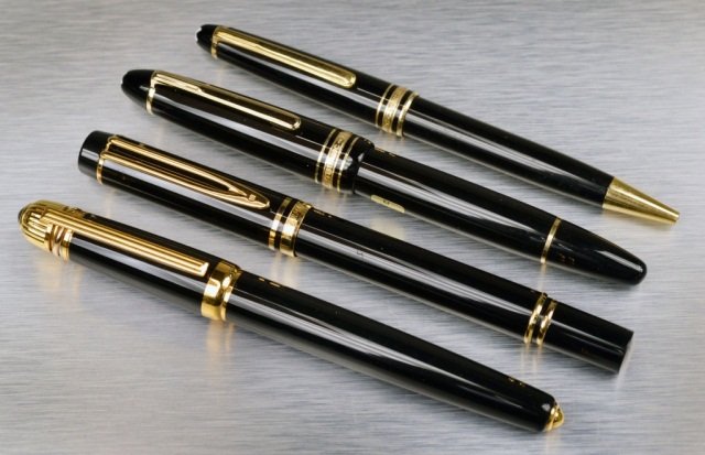 Four Pens: Comprising a Mont Blanc fountain pen and ball point pen, a Waterman fountain pen and a Cartier pen.
