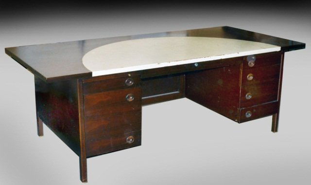 Dunbar Mahogany Executive Desk: Circa 1950, leather inset top, over a central drawer flanked by banks of drawers. Height 29 1/4 inches, width 7 feet 1 inch, depth 38 1/2 inches. Provenance: Historical Materialism, Hudson, New York