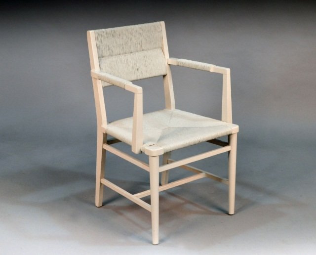 George Nelson Cream Painted Open Armchair: Rush back and seat, turned legs joined by a 'H' stretcher. Height 33 inches, width 20 1/2 inches, depth 19 inches. Provenance: Historical Materialism, Hudson, New York