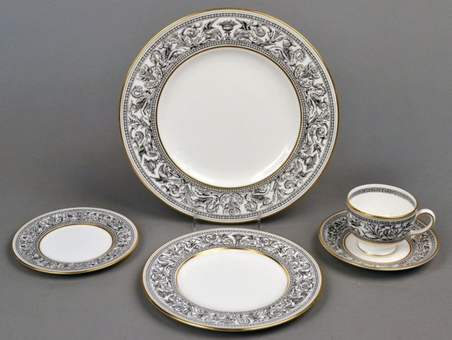 Wedgwood Porcelain Dinner Service: Florentine - Black outlined dragons (W4312) pattern, comprising eight dinner plates, eight bread plates, eight salad plates, eight cups and eight saucers. Dinner plate diameter 10 3/4 inches.