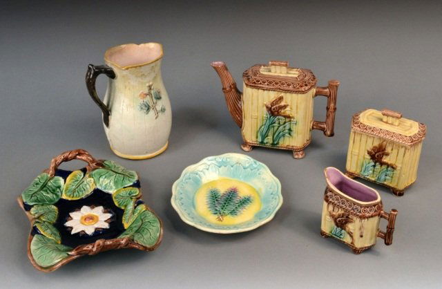 Miscellaneous Group of Majolica Table Articles: Comprising a three piece tea set, a two handled tray, an oval dish, and a pitcher. Pitcher height 8 inches.