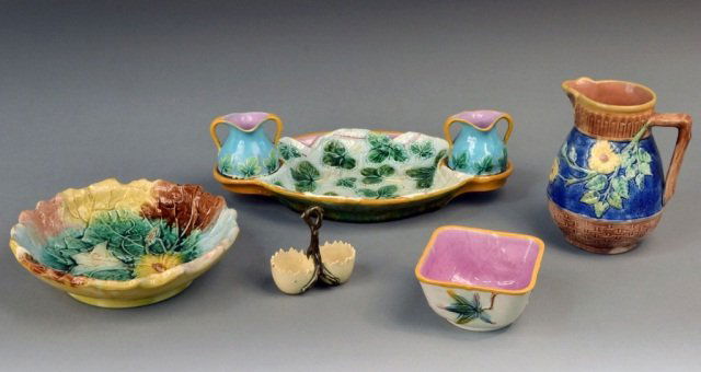 Miscellaneous Group of Majolica Table Articles: Various makers, comprising an oval tray with two jugs, a pitcher, a square dish, a circular dish and an egg cup. Pitcher, height 7 inches.