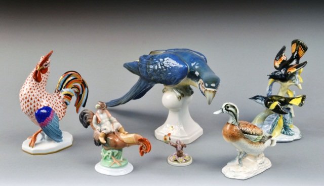 Miscellaneous Group of Porcelain Table Birds: Six birds, including a parrot, rooster, and duck. Parrot, height 9 inches, length 17 inches.