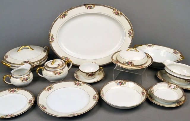Noritake Porcelain Dinner Service: Grasmere pattern, comprising eleven dinner plates, twelve salad plates, eleven bread plates, twelve soup plates, nine fruit bowls, ten cups, twelve saucers, and eleven assorted serving pieces includin