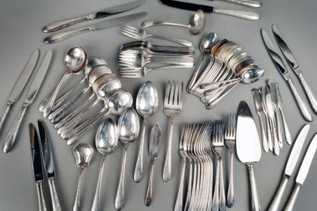Gorham Silver Plated Flatware Service: Comprising twelve dinner knives, twelve dinner forks, twelve tablespoons, twelve teaspoons, eight butter spreaders and four serving pieces.