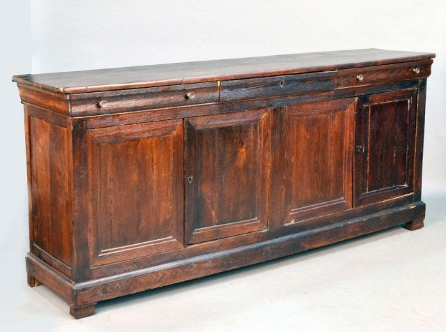 French Provincial Fruitwood Credenza: Rectangular top over three drawers and two two-door cabinets, bracket feet. Height 38 1/2 inches, width 7 feet 4 inches, depth 20 inches.