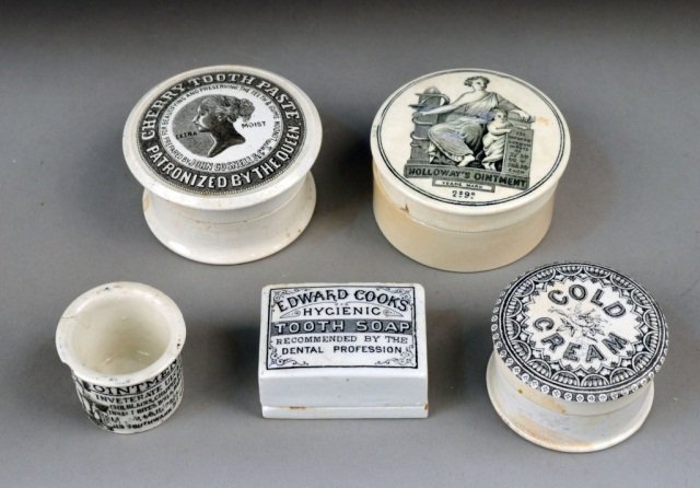 Group of English Porcelain Pharmacy Containers: Five boxes and jars for various ointments, pastes and soaps. Largest height 2 inches, diameter 3 1/8 inches.