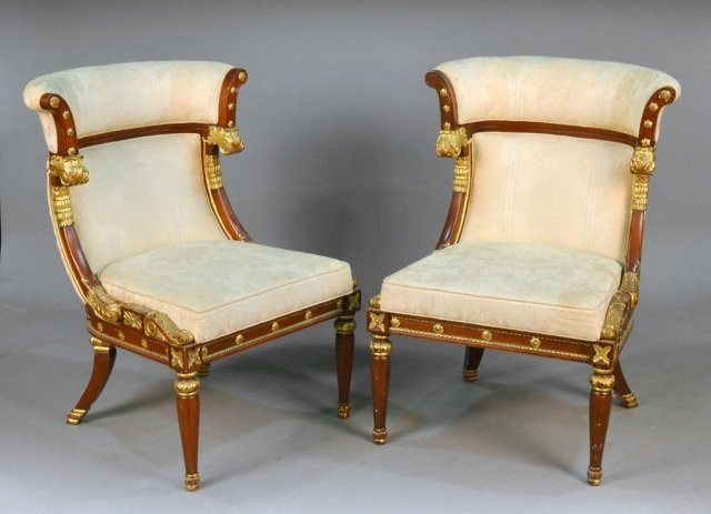 Pair of Empire Parcel Gilt Side Chairs: Cream damask upholstered back and seat, gilt acanthus leaf decoration, turned tapered legs. Height 28 inches, width 29 inches, depth 30 inches.