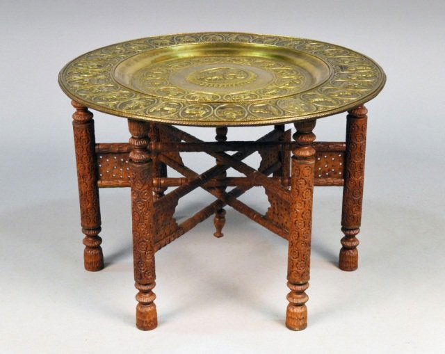 Brass Tray Top Table: Zodiac repousse decoration, turned and carved wood base. Height 21 inches, diameter 30 inches.