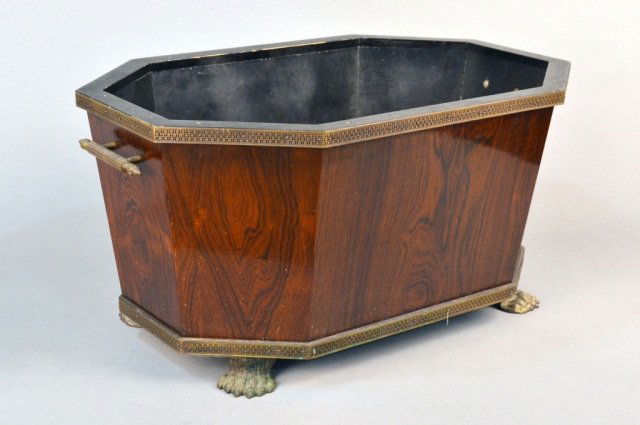 Victorian Style Brass and Mahogany Cellarette: Elongated octagonal shape with brass handles and brass paw feet. Height 14 inches, length 29 inches, depth 18 inches.