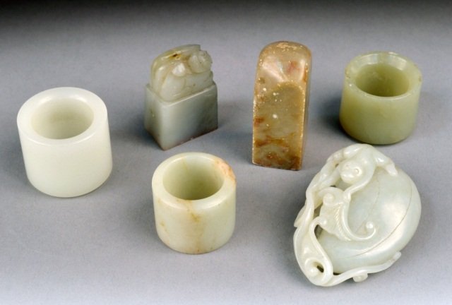 Group of Chinese Carved Jade & Soapstone: Carved jade pendant, two soapstone seals and three archer carved jade rings.