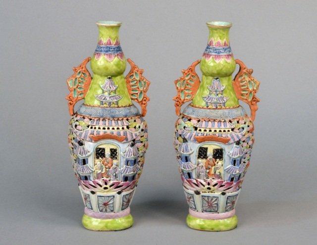 Pair of Asian Porcelain Puzzle Vases: Decoration of figures in a landscape. Height 13 1/2 inches.