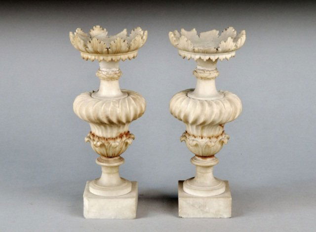Pair of Alabaster Vases: Classical style with carved leafy rim on an inverted baluster form ribbed body, square pedestal base. Height 15 inches.