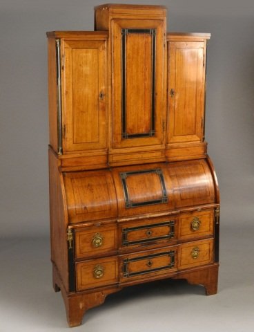 Dutch Mahogany Two Part Secretary: Upper section with a central single door cabinet flanked by two smaller cabinets, above a roll top desk opening to a fitted interior and a brushing slide, above two inlaid drawers, bracket feet. Heigh