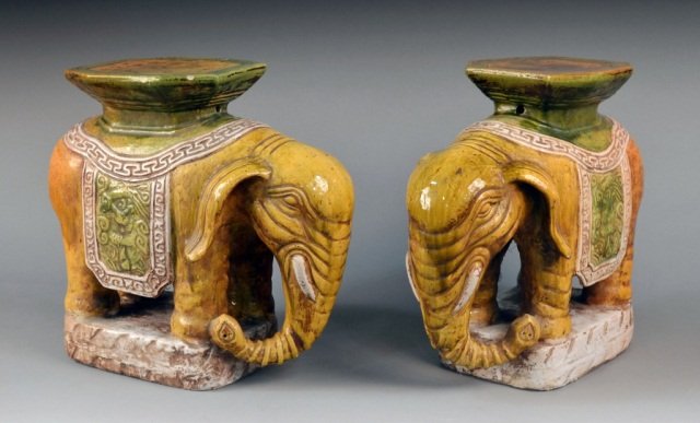 Pair of Porcelain Elephant Garden Seats: Sancai glazed figures modeled with trunks hanging down. Height 19 inches.