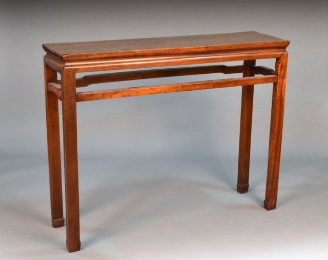 Asian Hardwood Altar Table: Rectangular top on square legs joined by a box stretcher. Height 401/2 inches, width 51 1/2 inches, depth 13 3/4 inches.