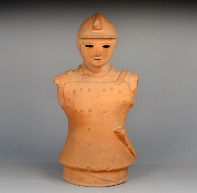 Japanese Terra Cotta Figure of a Warrior: Modeled facing forward, wearing a suit of armor. Height 26 inches.