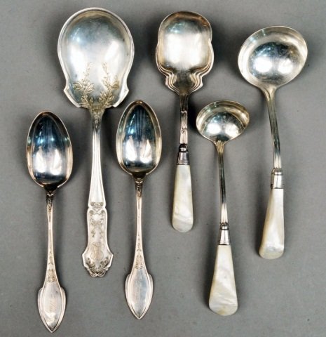 Miscellaneous Group of Silver Serving Flatware: Including mother of pearl handled serving spoon and two ladles a sterling silver casserole spoon, and a pair of Wood and Hughes sterling silver spoons. Total approximately 4 ounces.