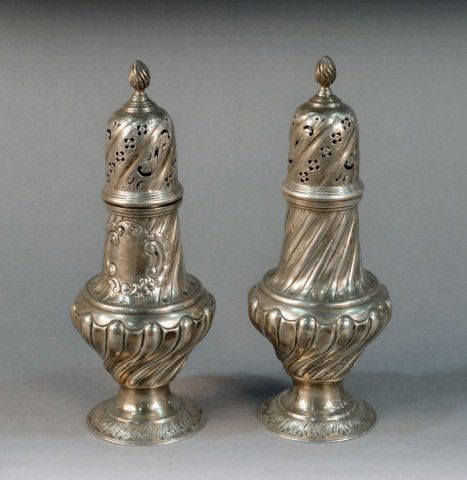 Pair of English Silver Casters: London, 1890, maker's mark of Samuel Walton Smith. pierced top. Height 10 1/8 inches, total approximately 18 ounces. Provenance: Estate of Michael "Mendy" Wager.