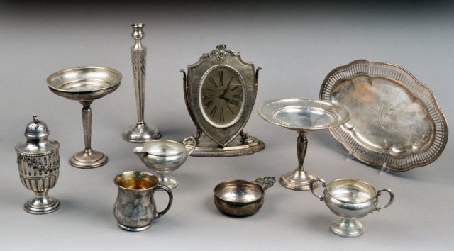 Miscellaneous Group of Sterling Table Articles: Comprising a Gorham mug, Wallace tray with reticulated border, two footed compotes, cream and sugar set, candlestick, porringer, caster and Waltham clock. Approximately 8 ounces, weighable.