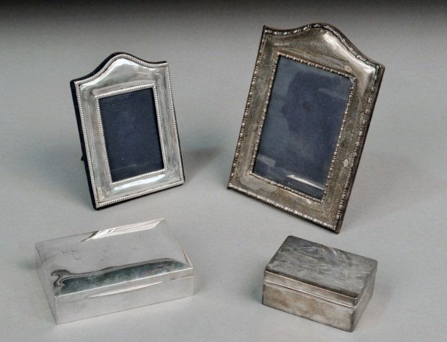 Group of Sterling Silver Articles: Two picture frames and two humidors. Tallest frame, height 18 inches.