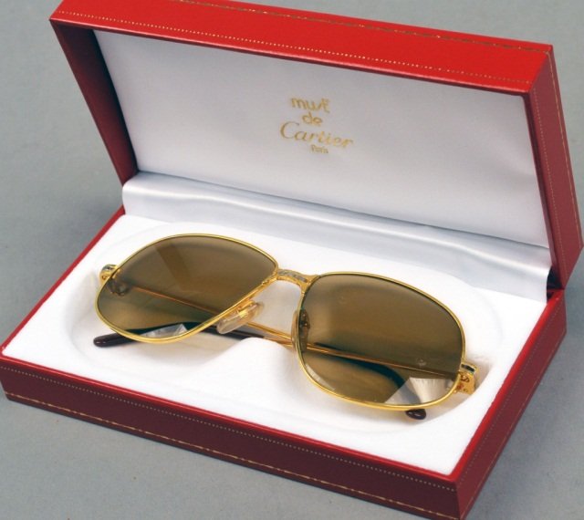 Cartier Aviator Sunglasses: Gold plated, with leather case and original box and certifcate of authenticity.