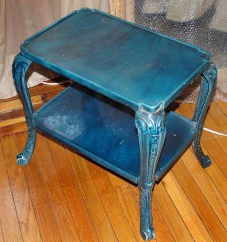 Blue Painted Iron Two Tier Table: Rectangular top above four cabriole legs, joined by a conforming shelf. Height 20 1/2 inches, width 22 inches, depth 15 inches. Provenance: Estate of Michael "Mendy" Wager.