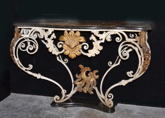 Neoclassical Style Marble Top Console: Shaped rectangular top with serpentine front on a parcel gilt and white painted scrolled iron base with conforming foot. Height 32 1/2 inches, width 46 1/2 inches, depth 22 inches.