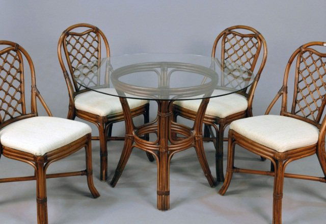 Faux Bamboo and Glass Dining Suite: Comprising a glass top circular table and four chairs en suite. Table, height 30 inches, diameter 42 inches.