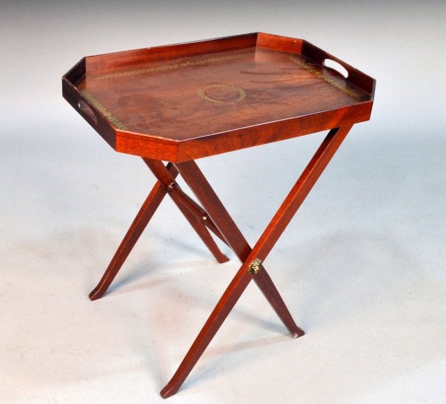 Mahogany Tray Table: Rectangular tray with cut corners and gilt foliage decoration on an 'X' form stand. Height 29 1/2 inches, tray 27 x 19 inches.
