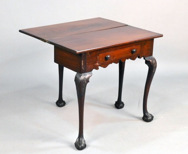 Mahogany Fold Top Game Table: 18th century, American. Rectangular top above a single later drawer, carved cabriole legs ending in claw and ball feet. Height 29 1/2 inches, width 32 inches, depth 14 3/4 inches.