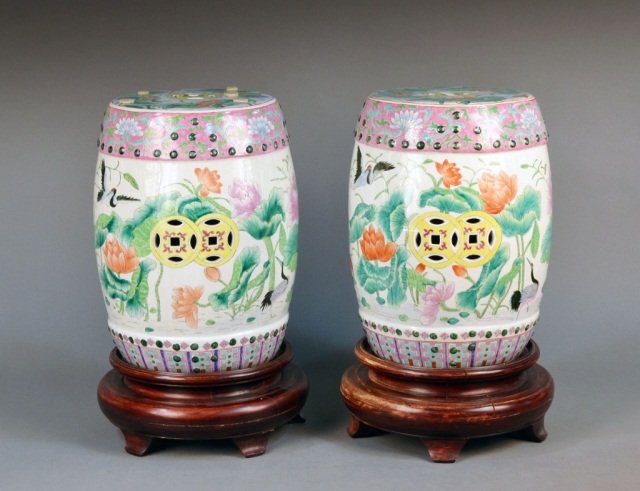 Pair of Chinese Porcelain Garden Seats: Typical form, decorated with cranes and pink flowers. Height 18 1/2 inches.