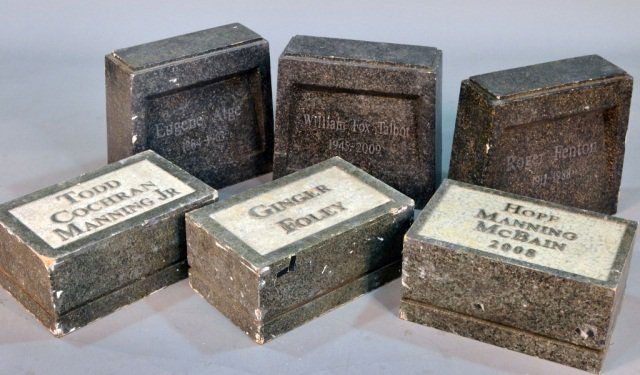 Group of Six Faux Painted Composition Tombstones: Comprising three raised flat grave markers and three small headstones. Names include Todd Cochran Manning Jr., Ginger Foley, Hope Manning McBain, William Fox Talbot, Roger Fenton, Eugene Atge. Flat gr