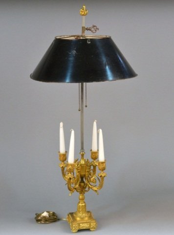 French Louis XVI Style Dore Bronze Lamp: Four arm boulliotte lamp with rams head motif. Height 34 inches, width 16 inches.