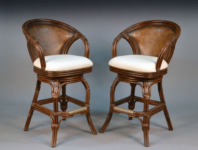 Set of Four Bar Stools: Horseshoe back faux bamboo, white cushion seats. Height 43 1/2 inches, width 24 inches, depth 21 inches.