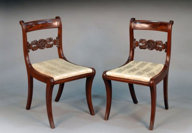Pair of American Federal Chairs: Circa New York 1800, Possibly Duncan Phyfe, each with tablet crest rail, upholstered seat and splayed saber legs. Height 44 inches, width 44 inches, depth 19 1/2 inches.