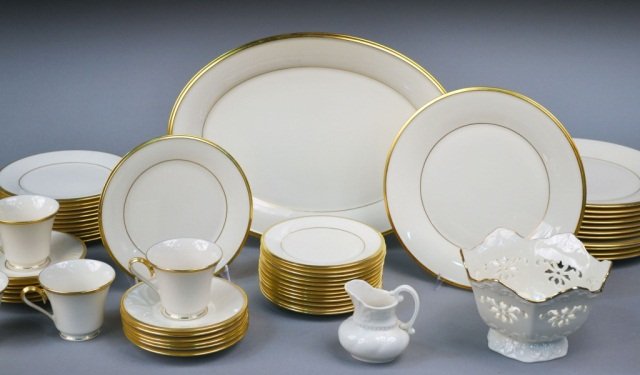 Lenox Porcelain Dinner Service: Eternal pattern, comprising eleven cups, twelve saucers, twelve bread plates, twelve salad plates, twelve dinner plates, and an oval platter; together with a small Lenox porcelain creamer and a Lenox 