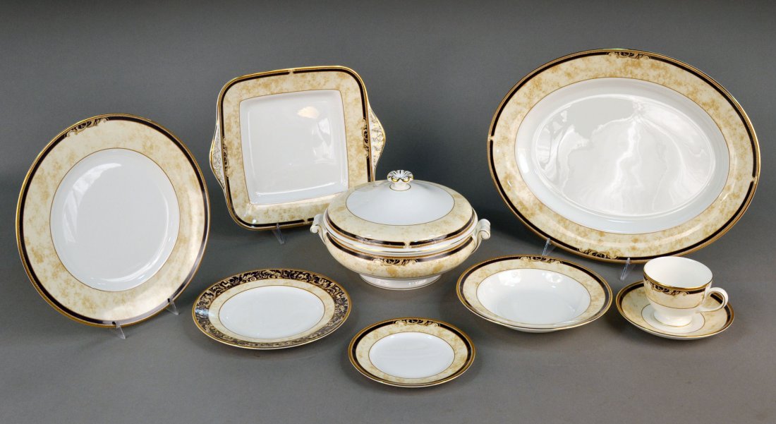 Wedgwood Porcelain Dinner Service: Cornucopia pattern, comprising twelve dinner plates, twelve soup plates, twelve salad plates, twelve bread plates, twelve cups and saucers, two covered entree dishes, two platters and two dessert tray
