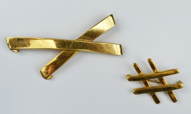 Two Tiffany & Co. Gold Paloma Picasso Pins: 18k yellow gold "X" pin. 8.2 dwt. and an 18k yellow gold double "X" pin. 4.4 dwt.