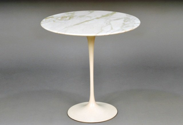 Eero Saarinen (Finland (1910-1961) Table #: Marble top, painted metal base. Height 20 1/2 inches, diameter 20 1/2 inches.