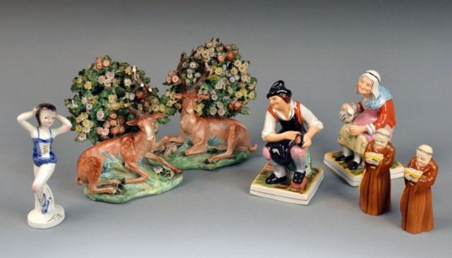 Miscellaneous Group of Ceramic Figures #: Comprising a pair of bocage figures with stags, a pair of Staffordshire style figures, two Royal Worcester porcelain monk shaped candle snuffers, etc. Bocage figures, height 7 1/2 inches.
