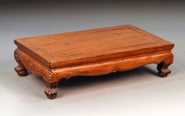 Asian Style Hardwood Low Table: Rectangular top, ball and claw feet. Height 9 inches, width 34 inches, depth 19 inches.