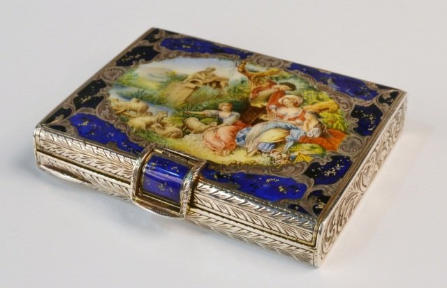 Italian Silver and Enamel Minaudiere: Engraved scroll decoration, cobalt enamel accent centering a pastoral scene. 4 x 3 inches.