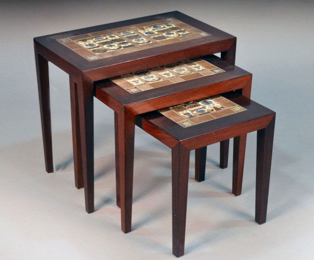Danish Royal Copenhagen Teak Nest of Three Tables: Each with rectangular top with inset porcelain tiles, on square tapered legs, labeled under top. Largest height 20 inches, width 23 1/4 inches, depth 14 inches.